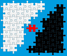 puzzle noir / blanc, pièce clé rouge sur fond bleu