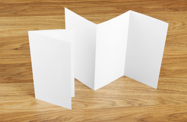 Blank folding page booklet on wooden background