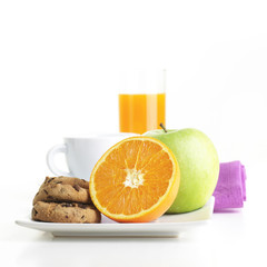 Healthy Breakfast with coffee, orange, apple and cookie