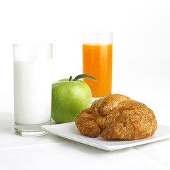 Breakfast with milk, orange and apple