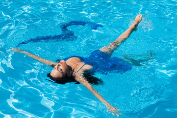 Woman swimming, pool