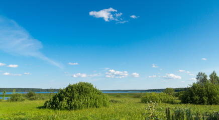 Fototapeta na wymiar Summer landscape of meadow lake and sky