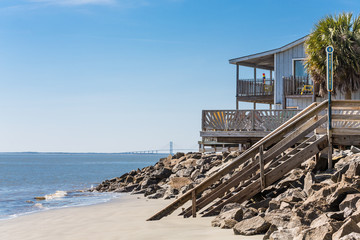 Fototapeta premium Beach House with Bridge in Background