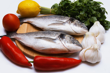 Cooked fish sea bream fish with lemon, parsley,garlic.