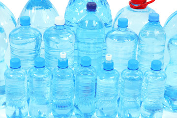 Water in different bottles isolated on white
