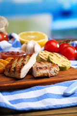 Grilled steak, grilled vegetables and fried potato pieces