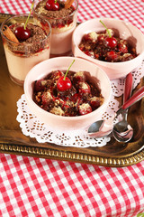 Tasty cherry dessert on table