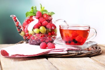 Fruit red tea with wild berries in glass cup,