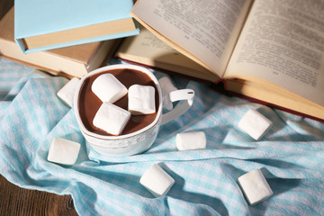 Cup of hot chocolate on table, close up