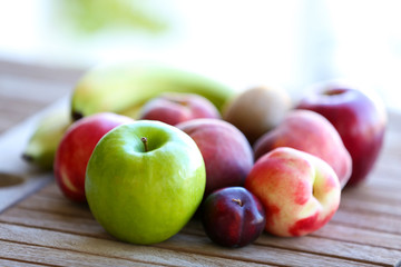 Juicy fruits on wooden table, close-up