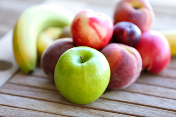 Juicy fruits on wooden table, close-up