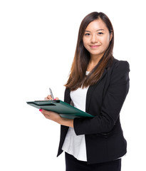 Asian business woman write on clipboard