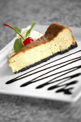 close up lemon cheese cake in white dish