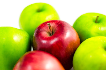red apple in the middle  among green and red apples