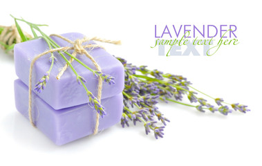 Handmade soap and lavender flowers on a white background