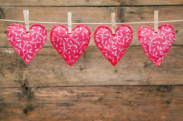Red hearts hanging on the clothesline