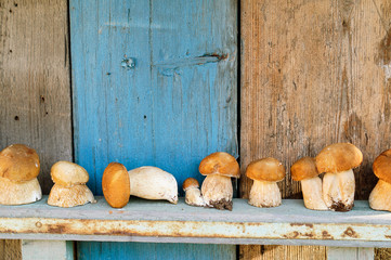 Some mushrooms on wooden background