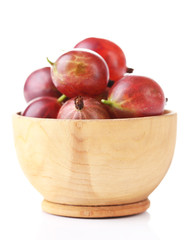 Ripe gooseberries in bowl isolated on white.
