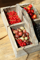 Fresh berries in wooden box, close up