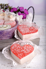 Sweets with flowers on wooden background