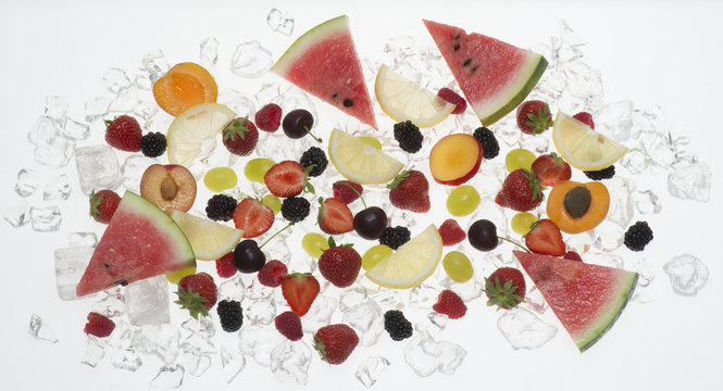 fruits with ice on white background