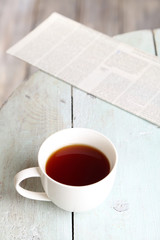 Cup of tea on wooden table, outdoors