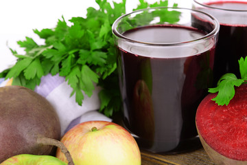 Glasses of fresh beet juice and vegetables