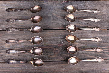 Old vintage spoons on wooden table