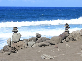 scene of zen with stones at beach