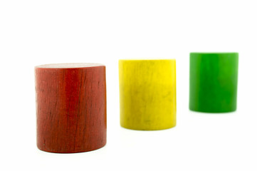 Wooden colored toys isolated on white background