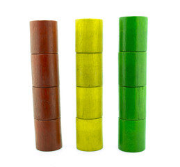 Wooden colored toys isolated on white background