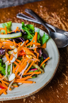Healthy salad with carrot,almond and cheese