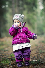 Small girl in the forest