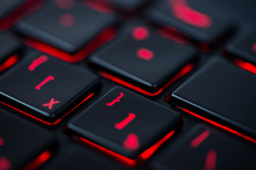 Modern red backlit keyboard, concept computer background