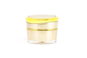 Gold cream container on white background
