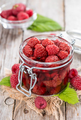 Glass with Canned Raspberries