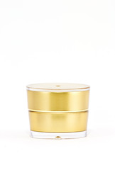 Gold cream container on white background