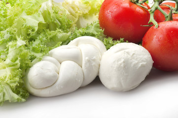 Mozzarella tomatoes and fresh salad on the white