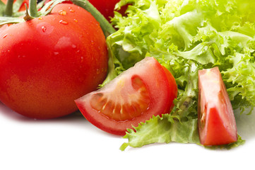 Red tomato and drops water close up