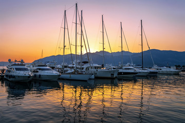 Fototapeta premium Sailing boats in marina at sunset.