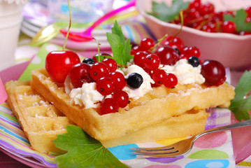 waffles with whipped cream and fresh summer fruits