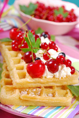 waffles with whipped cream and fresh summer fruits