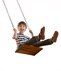 Boy having fun on a swing, on a white background. - obrazy, fototapety, plakaty