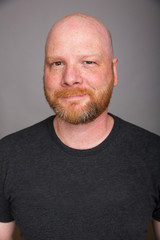 Obraz premium Friendly bald man with a beard