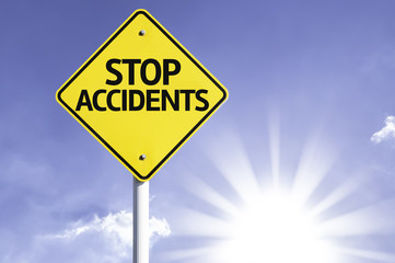 Stop Accidents road sign with sun background