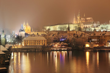 Fototapeta na wymiar Night snowy Prague City with gothic Castle, Czech republic