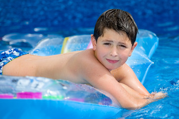 Boy in swimming pool