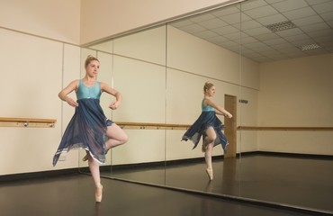 Beautiful ballerina dancing in front of mirror © WavebreakmediaMicro