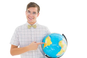 Geeky hipster holding a globe smiling at camera