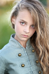 portrait of little girl outdoors in summer